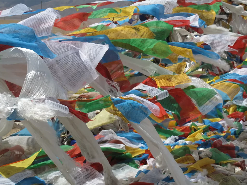 Prayer flags snap in the wind at Langen-la, 5,150m, en route to Lake Nam-tso with Tony Gualtieri and guide Tenzin, May '15