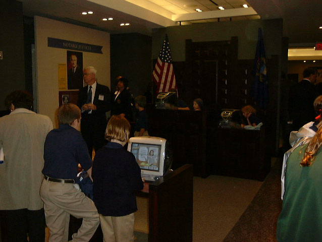 Faithful re-creation of a traditional courtroom provided an evocative setting for five role-playing interactives. Each illustrates the duties and challenges of a key player in court: judge, juror, witness, plaintiff, and defendant.