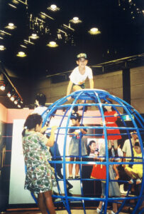 Group play on blue climbing globe.